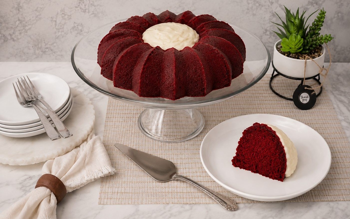 Red velvet bundt cake with cream cheese filling, sliced